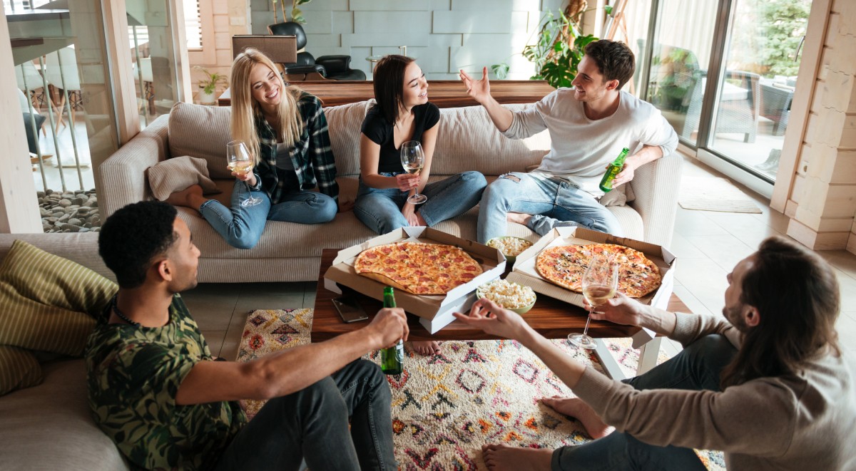 young people sharing pizza