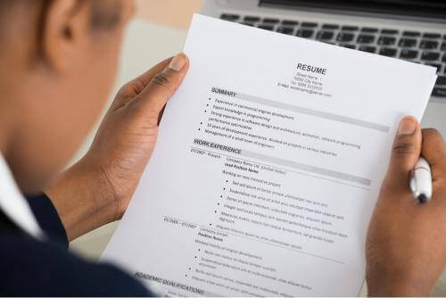 Person holding a resume 